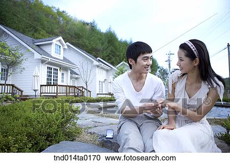 man and woman putting their wedding band View Large Photo Image Stock Image - man and woman putting their wedding band. Fotosearch