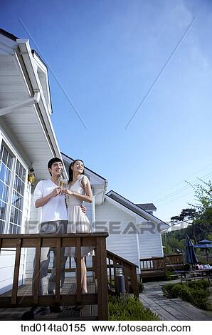 Stock Photography - Newly married couple are in the balcony. Fotosearch