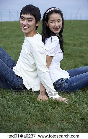 silver couple leaning on the grass field View Large Photo Image Stock Photo - silver couple leaning on the grass field. Fotosearch