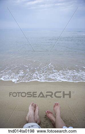 wave and tides, bare foot of couple View Large Photo Image Stock Photo - wave and tides, bare foot of couple. Fotosearch