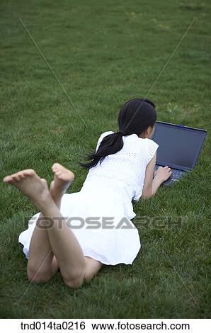 woman with computer on the grass field View Large Photo Image Stock Photograph - woman with computer on the grass field. Fotosearch