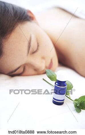 laying woman and aroma oil and herb View Large Photo Image Stock Photo - laying woman and aroma oil and herb. Fotosearch