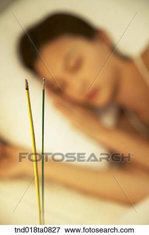 sleepign woman in the bed with candle and incense., incensed candle close-up View Large Photo Image Stock Photo - sleepign woman in the bed with candle and incense., incensed candle close-up. Fotosearch