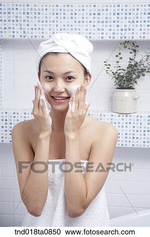 Stock Image - woman doing bubble wash. Fotosearch