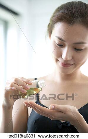 woman holding aroma oill View Large Photo Image Stock Image - woman holding aroma oill. Fotosearch