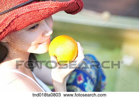 woman holding orange View Large Photo Image Stock Image - woman holding orange. Fotosearch