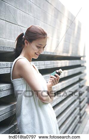 woman leaning on the wall with aroma oil View Large Photo Image Stock Photo - woman leaning on the wall with aroma oil. Fotosearch