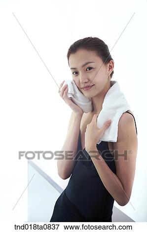 woman rubbing her face with towel View Large Photo Image Stock Photo - woman rubbing her face with towel. Fotosearch