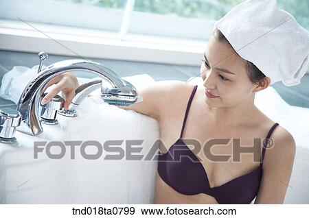woman sitting on the bath tub View Large Photo Image Stock Photo - woman sitting on the bath tub. Fotosearch