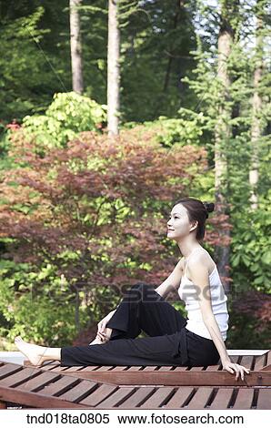 woman sitting on the bench of the park View Large Photo Image Stock Photography - woman sitting on the bench of the park. Fotosearch
