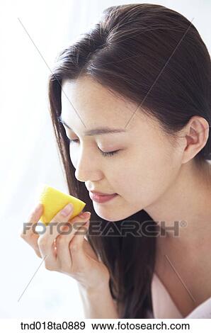 woman smelling lemon View Large Photo Image Stock Photo - woman smelling lemon . Fotosearch