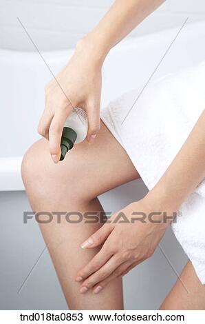 woman spraying body mist on ther leg View Large Photo Image Stock Image - woman spraying body mist on ther leg. Fotosearch