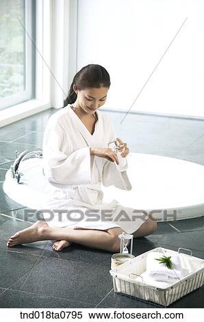woman spreading body lotion on her body View Large Photo Image Stock Photography - woman spreading body lotion on her body. Fotosearch