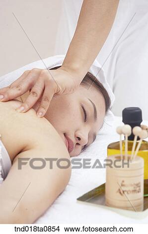 woman taking massage from massagist View Large Photo Image Picture - woman taking massage from massagist. Fotosearch