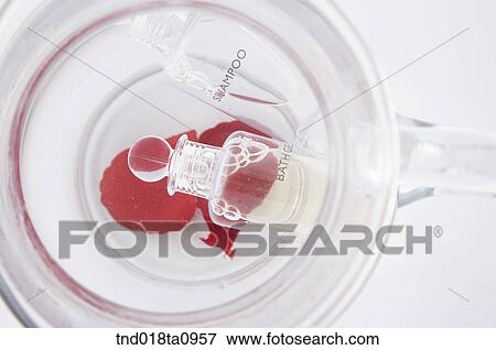 Stock Photo - aroma theraphy and petalsl. Fotosearch