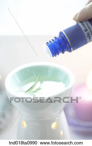 Stock Image - aroma theraphy, aroma oil and incensed candle andaroma oil. Fotosearch