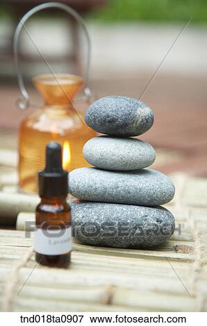 hot stone for theraphy and aroma oil View Large Photo Image Stock Photo - hot stone for theraphy and aroma oil. Fotosearch