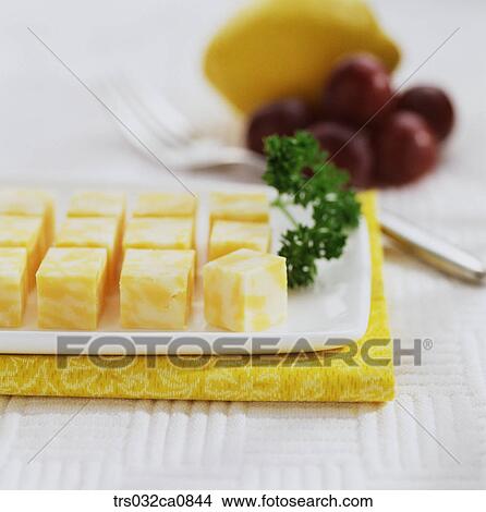 Picture - dairy products, food, cheese, Cheddar, plate, closeup. Fotosearch