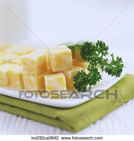 Stock Image - dairy products, food, cheese, Cheddar, plate, closeup. Fotosearch