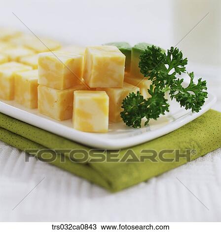Stock Image - dairy products, food, cheese, Cheddar, plate, closeup. Fotosearch