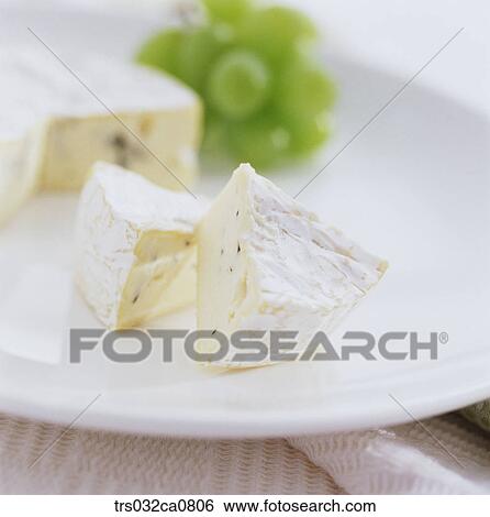 Stock Photograph - dairy products, food, cheese, slice, cream cheese, brie cheese, Camembert cheese. Fotosearch