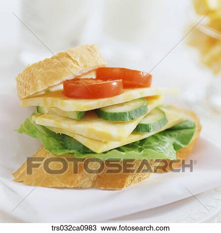 Stock Image - food, confectionery, bread, baguette, tomato, cucumber, cheese. Fotosearch