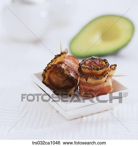 Stock Photograph - Western food, food, dish, rolled bacon, bacon, skewerdish, skewer. Fotosearch