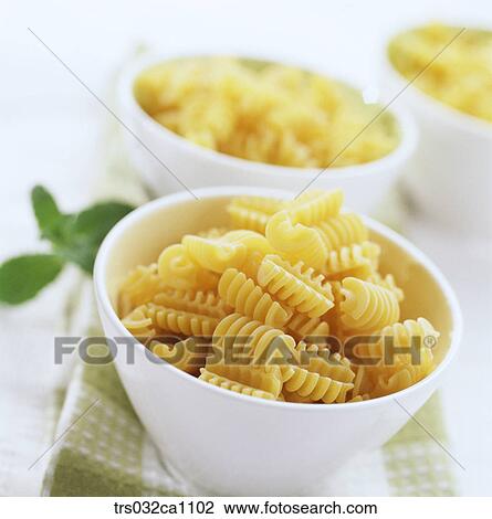Stock Image - food, food material, noodle, noodle, Radiatore, pasta, closeup. Fotosearch