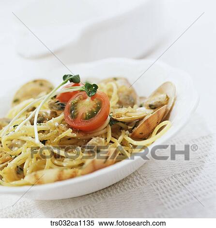 Stock Photography - Western food, dish, food, spaghetti, tomato, shell, seashell. Fotosearch