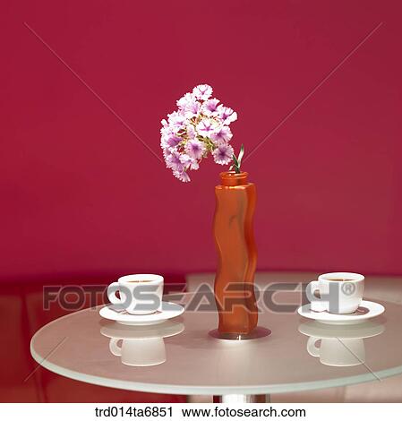 Stock Image - inside, table, beverage, drink, coffee cup, vase, decoration. Fotosearch