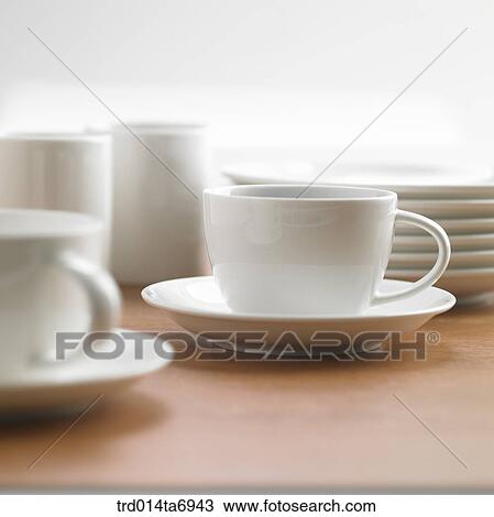 Stock Image - object, table, tableware, coffee cup, cup, mug, plate. Fotosearch