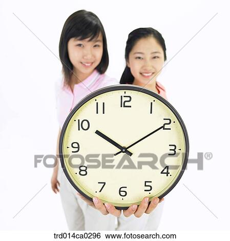 Stock Photograph - high school student, education, object, Asian, smile, wall clock. Fotosearch