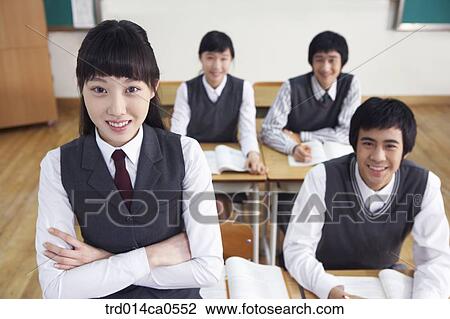 Stock Image - school uniform, classroom, education, boy, daytime. Fotosearch