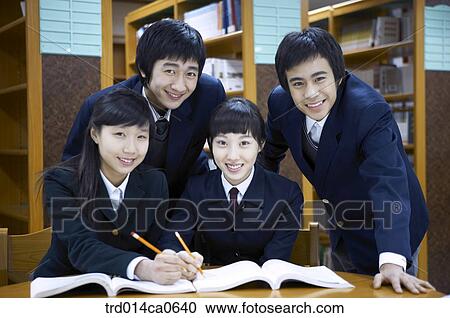 Stock Image - school uniform, classroom, education, boy, daytime. Fotosearch