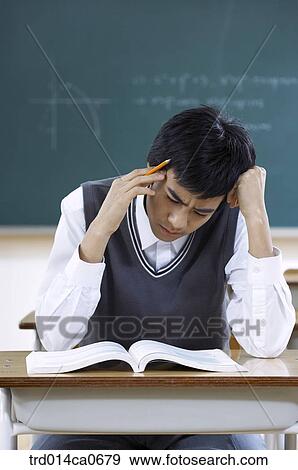 Stock Photo - school uniform, classroom, education, boy, daytime. Fotosearch