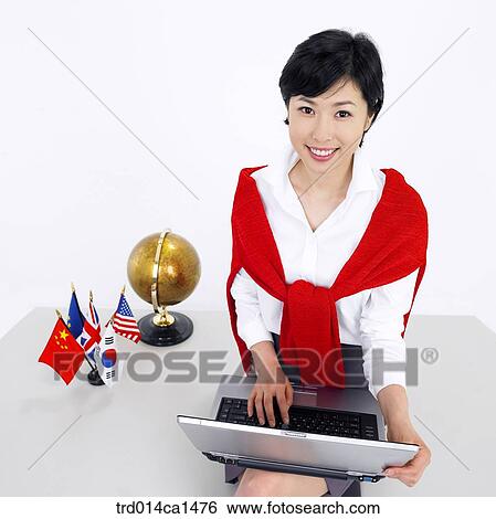 Stock Photograph - person, Asian, Korean, object, business, woman. Fotosearch