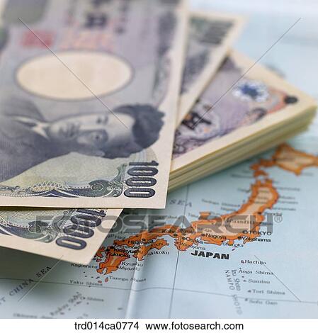 Picture - economy, money, worldwide map, yen, Japan, bill, concept. Fotosearch