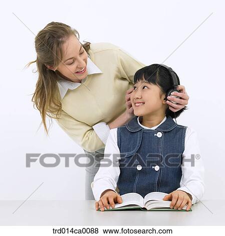 Stock Photo - education, object, Asian, facing, smile, white man. Fotosearch