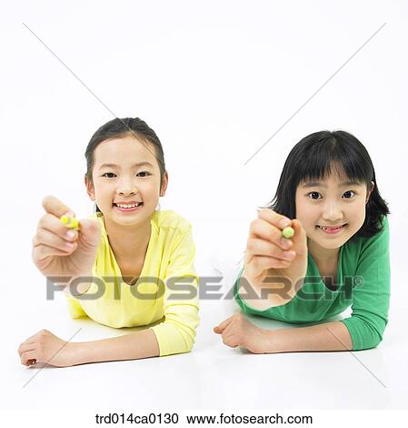 Stock Image - education, object, Asian, smile, person, color pencil. Fotosearch