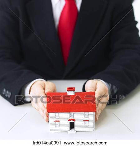 Stock Image - house, house, model, hand, concept, real estate, person. Fotosearch