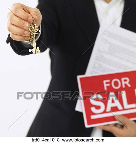 Stock Photo - object, words, slogan, document, key, golden key, hand. Fotosearch