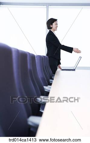Stock Image - person, Asian, woman, indoor, interior, daytime. Fotosearch