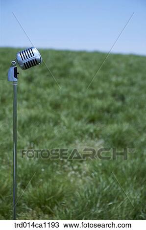 Stock Image - outdoor, rest, daytime, microphone, grassland, sky. Fotosearch