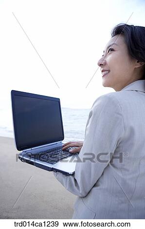 Stock Photo - person, Asian, woman, outdoor, business, rest. Fotosearch