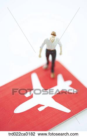 Stock Image - person, people, personshape, doll, figure, red, passportcase. Fotosearch