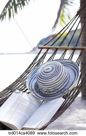 Stock Photo - beach, water, sand, book, books, outdoor, day. Fotosearch