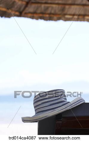 hat, cap, beach, strawroofedhouse, outdoor, day, daytime View Large Photo Image Stock Photo - hat, cap, beach, strawroofedhouse, outdoor, day, daytime. Fotosearch