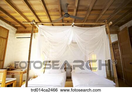 Stock Photograph - indoor, day, daytime, bedroom, bed, pillowsheet, bedsheet. Fotosearch