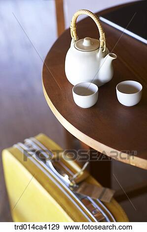 Stock Photo - table, kettle, teakettle, cup, bag, travel, trip. Fotosearch