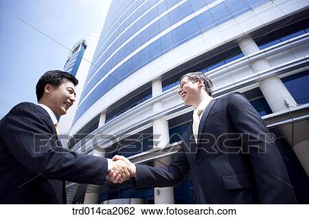 Stock Image - person, people, severalhumanrace, westernperson, coucasian, oriental, orientals. Fotosearch